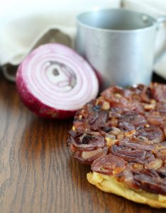 Salty tarte tatin with red onions.