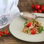 Spelt salad with cherry tomato, arugula, Parmesan and balsamic vinegar.