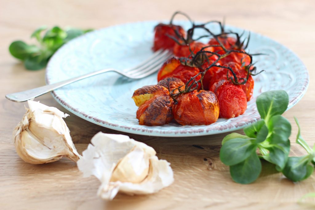 Roasted cherry tomatoes or " red drug".