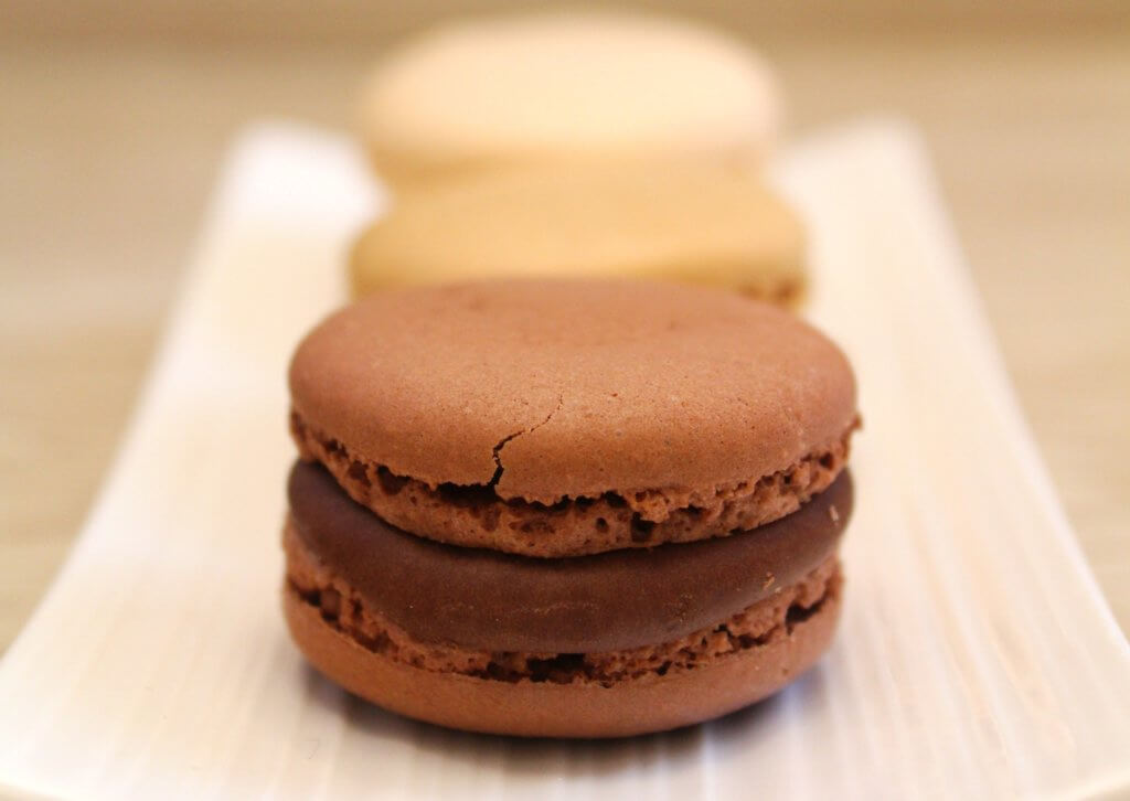 Chocolate macarons, recipe by Luca Montersino.